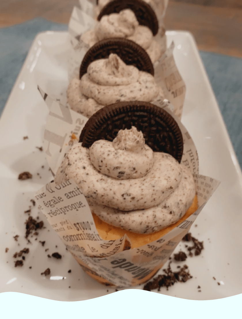 gluten free cupcakes topped with frosting and an Oreo