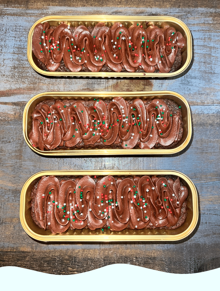 Gluten Free brownies topped with chocolate frosting and sprinkles