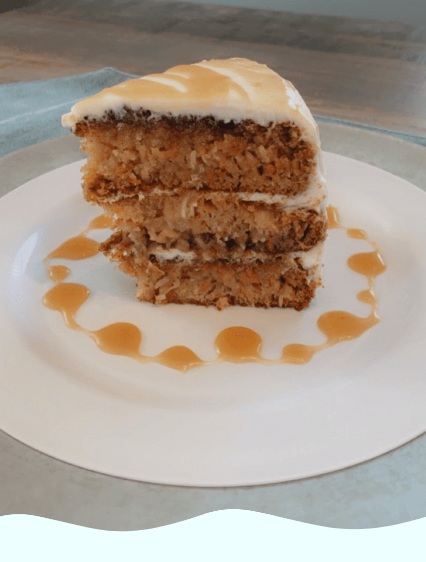 A slice of gluten free carrot cake on a white plate